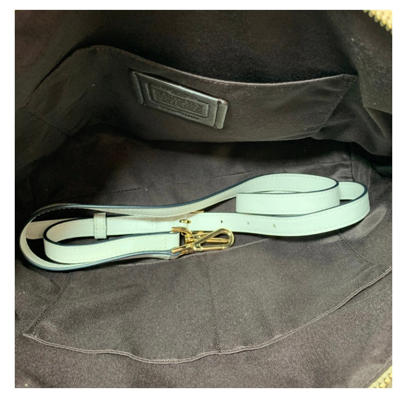 Ditch the typical black bag and grab this gently used Coach Beige Cream Signature Monogram Tote with its roomy interiors it's the perfect everyday bag to carry your essentials and more.