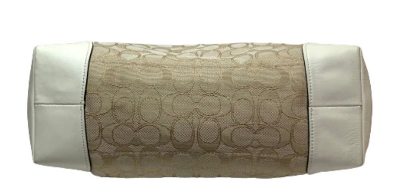 Ditch the typical black bag and grab this gently used Coach Beige Cream Signature Monogram Tote with its roomy interiors it's the perfect everyday bag to carry your essentials and more.