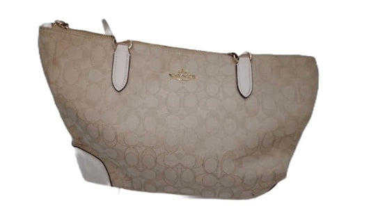 Ditch the typical black bag and grab this gently used Coach Beige Cream Signature Monogram Tote with its roomy interiors it's the perfect everyday bag to carry your essentials and more.